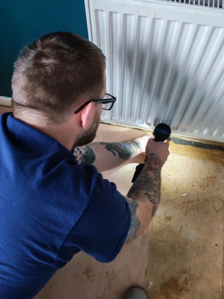 The Bedfordshire Plumber inspecting radiator pipe leak